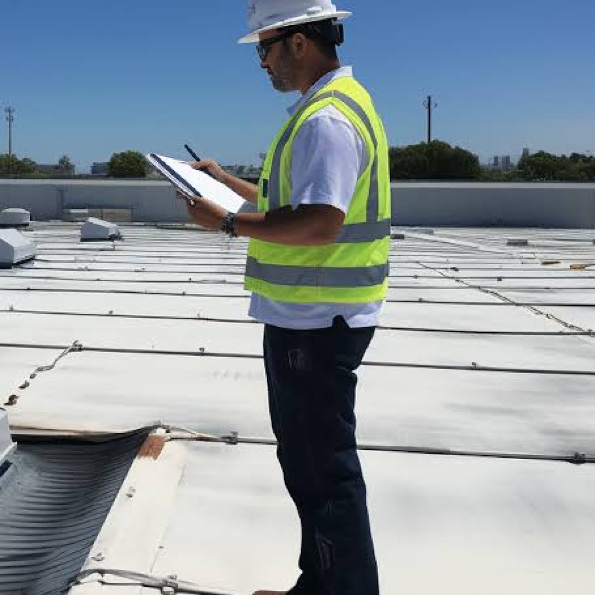 Commercial roof inspection on a flat roofing system in Palm Bay FL